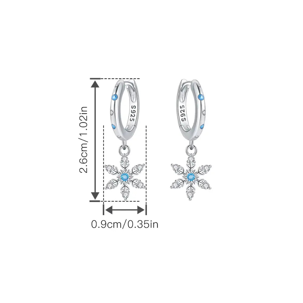 Kolczyki srebrne – koła z płatkami śniegu i niebieskim blaskiem