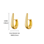 Złote kolczyki hoop — geometryczne, smukłe i nowoczesne